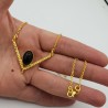 Vergulde ketting met hanger gezet met ovale Onyx