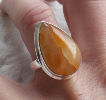 Zilveren ring gezet met druppelvorm oranje Calciet 17.3 mm