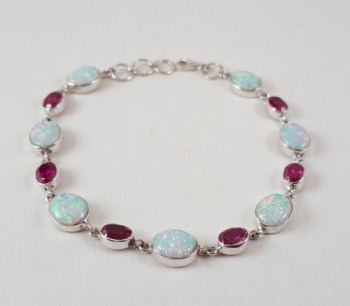 Zilveren armband gezet met fire Opalen en roze quartz