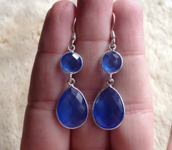 Zilveren oorbellen met ronde en druppelvorm blauw Topaas