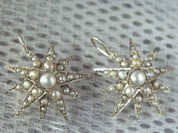 Zilveren oorbellen sterren gezet met Parels