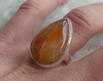 Zilveren ring gezet met druppelvorm oranje Calciet 17.3 mm